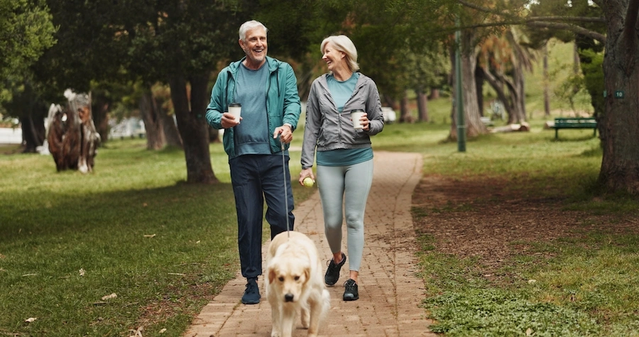 Active adult walking outdoors after GAE treatment for knee osteoarthritis